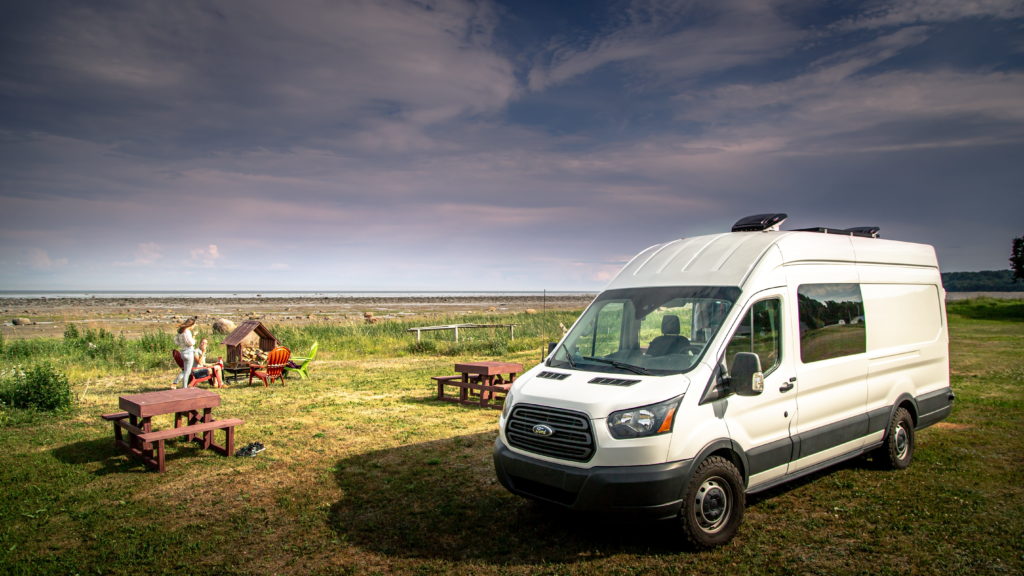 People holidaying in a converted van