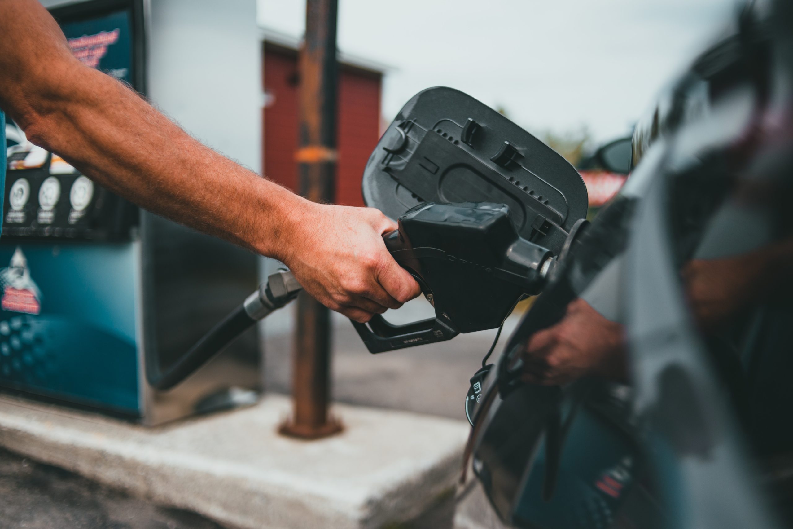 person fuelling their car